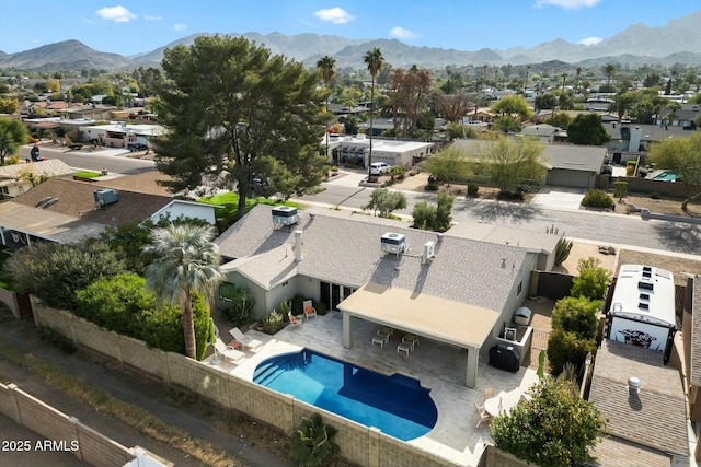 birds eye view of property with a mountain view