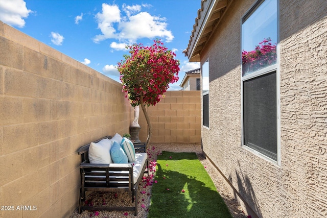 view of home's exterior with outdoor lounge area