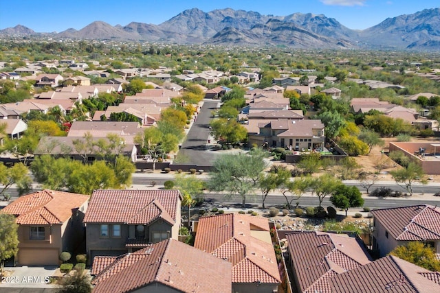 birds eye view of property featuring a mountain view