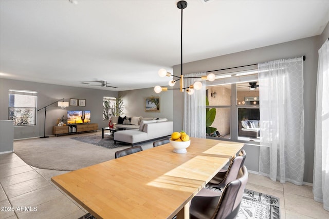 tiled dining room featuring ceiling fan