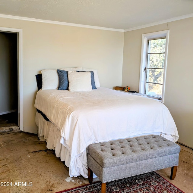 bedroom with crown molding