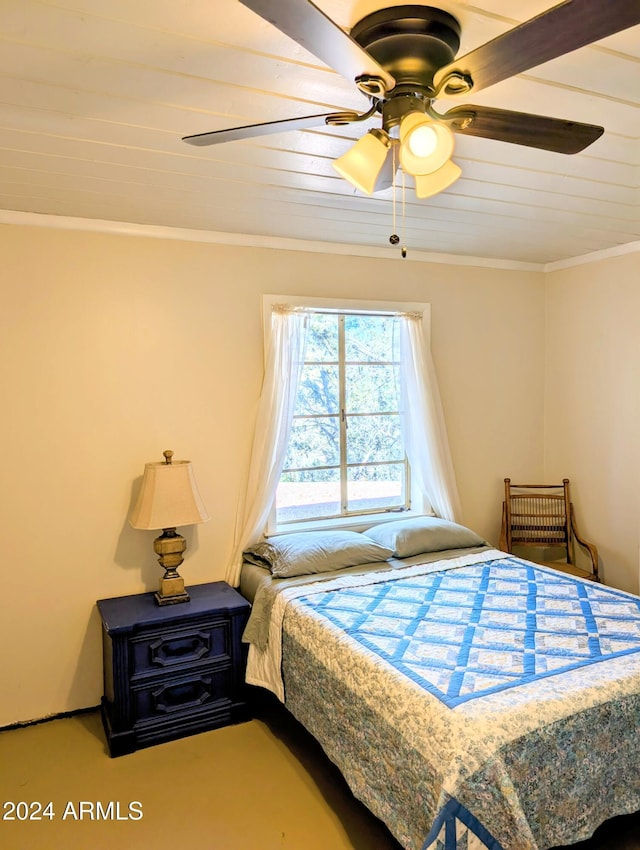 bedroom with ceiling fan and ornamental molding