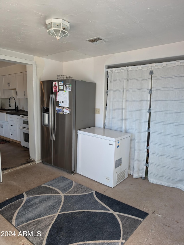 interior space with visible vents and a sink