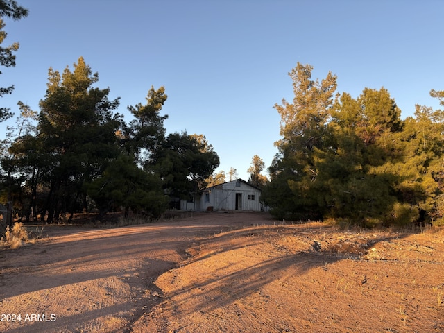 exterior space featuring dirt driveway