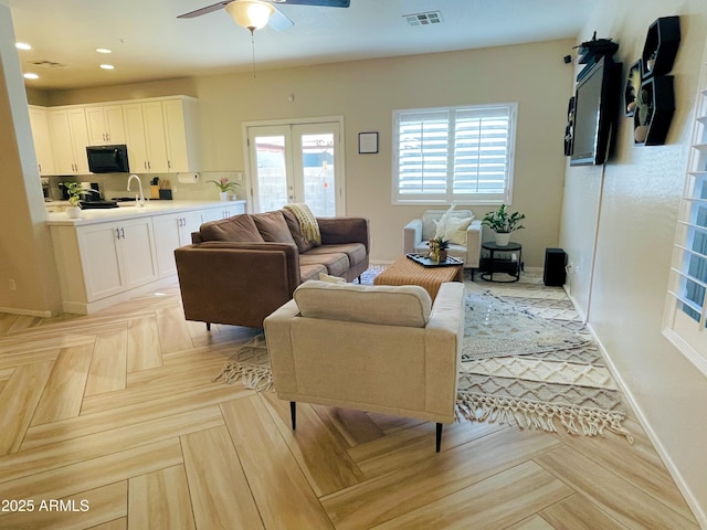 13540 N 87th Dr, Peoria, AZ 85381 - living area featuring a ceiling fan, baseboards, and recessed lighting