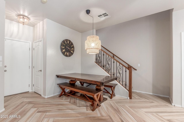13540 N 87th Dr, Peoria, AZ 85381 - dining space featuring baseboards, stairway, and a chandelier