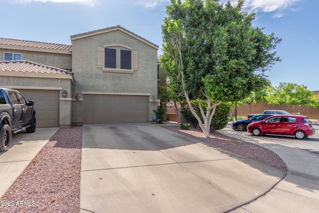 13540 N 87th Dr, Peoria, AZ 85381 - view of front of house with stucco siding, a garage, driveway, and a tiled roof