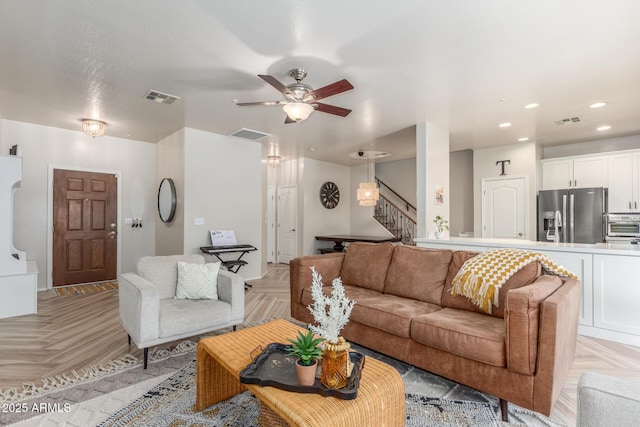 13540 N 87th Dr, Peoria, AZ 85381 - living area featuring stairway, ceiling fan, and recessed lighting