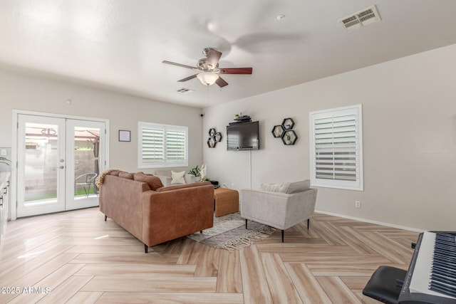 13540 N 87th Dr, Peoria, AZ 85381 - living room featuring ceiling fan, french doors, and baseboards