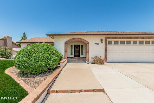 18820 N 33rd Ave, Phoenix, AZ 85027 - view of front of house with concrete driveway, an attached garage, and stucco siding