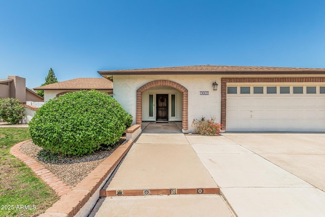 18820 N 33rd Ave, Phoenix, AZ 85027 - view of front of house featuring stucco siding, driveway, and a garage