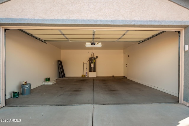 garage with a garage door opener, electric water heater, and driveway