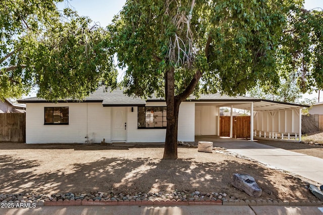 view of front of home featuring a carport