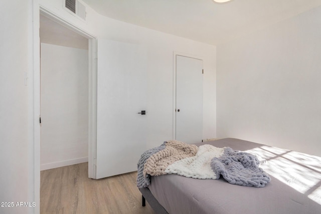 bedroom featuring light hardwood / wood-style floors