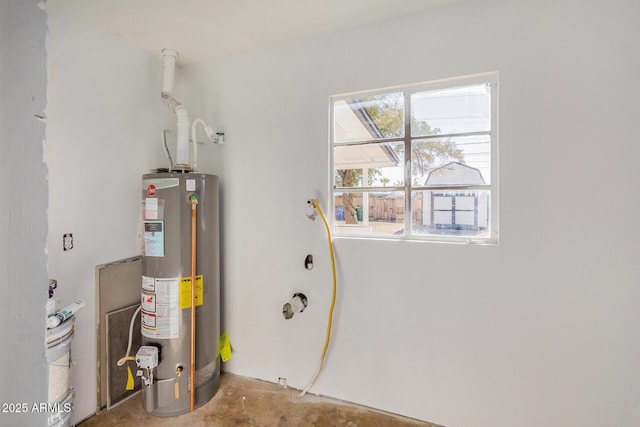 utility room featuring water heater