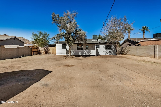 back of property with central air condition unit