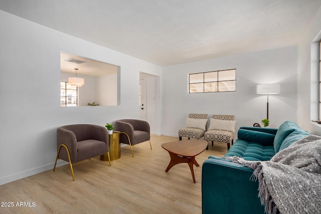 living room with light hardwood / wood-style floors