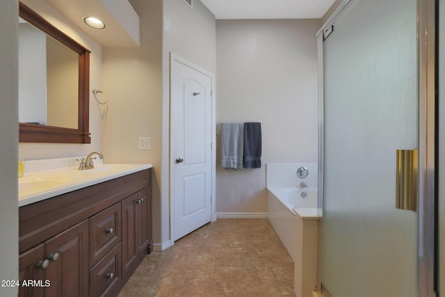 bathroom with a bathing tub and vanity