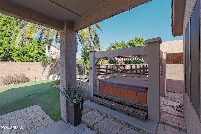 view of patio with a hot tub