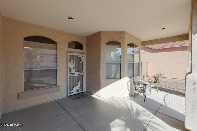 property entrance featuring stucco siding