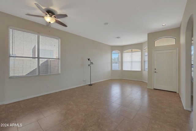 foyer entrance featuring ceiling fan and light tile patterned floors