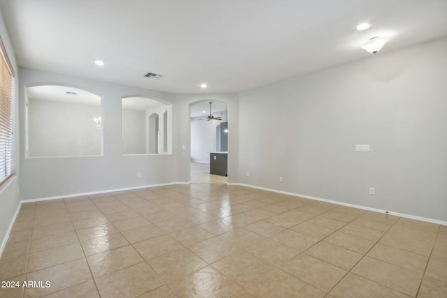 unfurnished room featuring ceiling fan and light tile patterned floors