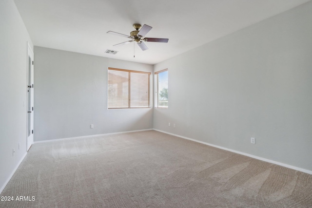 carpeted empty room with ceiling fan