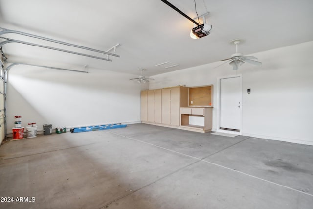 garage with ceiling fan and a garage door opener