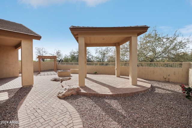 view of patio featuring an outdoor fire pit