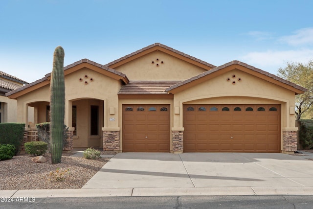 view of front of property featuring a garage