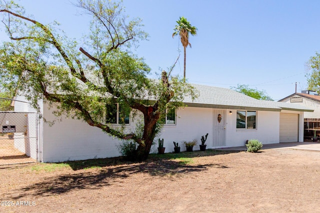 10012 N 16th Dr, Phoenix, AZ 85021 - ranch-style home featuring a garage, fence, concrete driveway, and brick siding