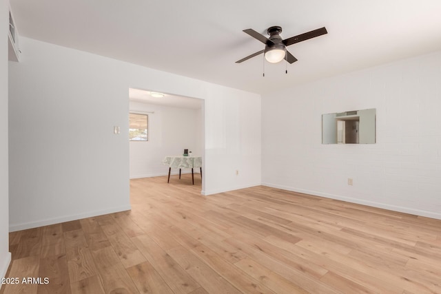 10012 N 16th Dr, Phoenix, AZ 85021 - unfurnished room featuring light wood finished floors, a ceiling fan, and baseboards
