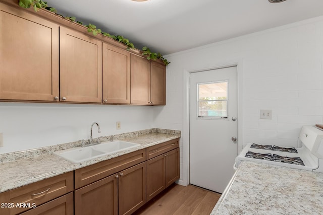 10012 N 16th Dr, Phoenix, AZ 85021 - kitchen with a sink, white gas range, light wood-style floors, and light countertops