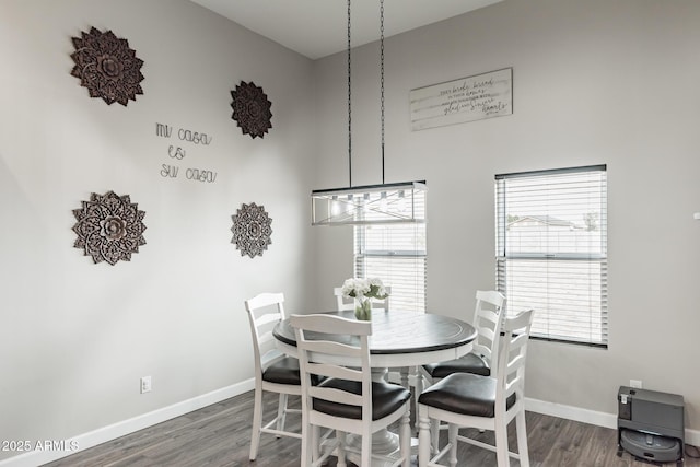 dining space with dark wood-type flooring