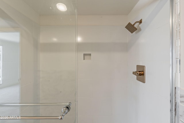 full bathroom with tiled shower