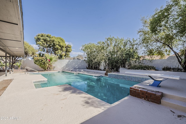 view of pool with a fenced in pool, a fenced backyard, and a patio