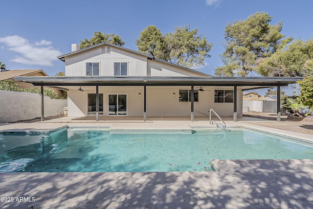 back of house with a patio area, ceiling fan, and a fenced in pool