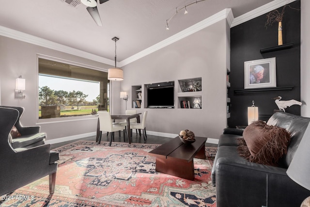 living room featuring ceiling fan, wood-type flooring, crown molding, and vaulted ceiling