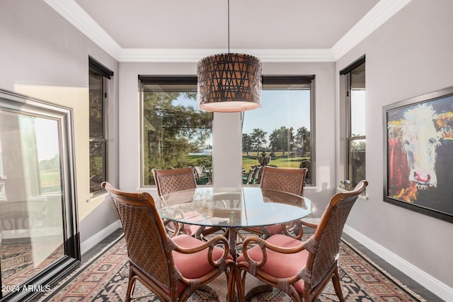 dining area featuring crown molding