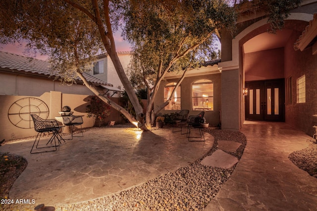 view of patio terrace at dusk