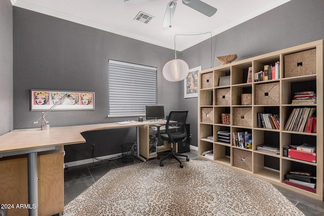 office featuring dark tile patterned floors, ceiling fan, and ornamental molding