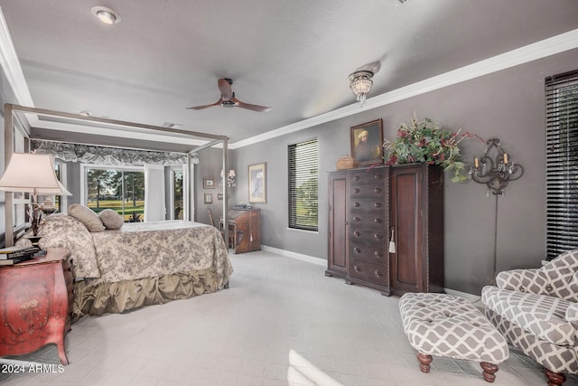 bedroom featuring ceiling fan and crown molding