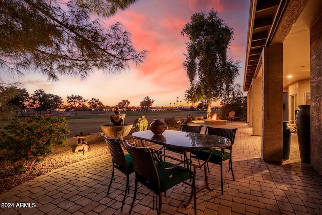 patio terrace at dusk with a fire pit