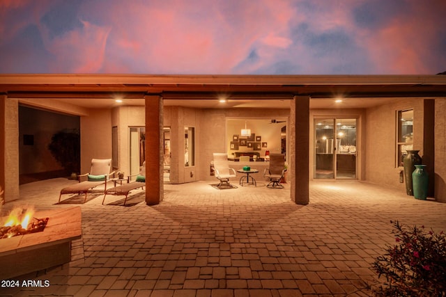 patio terrace at dusk with an outdoor fire pit