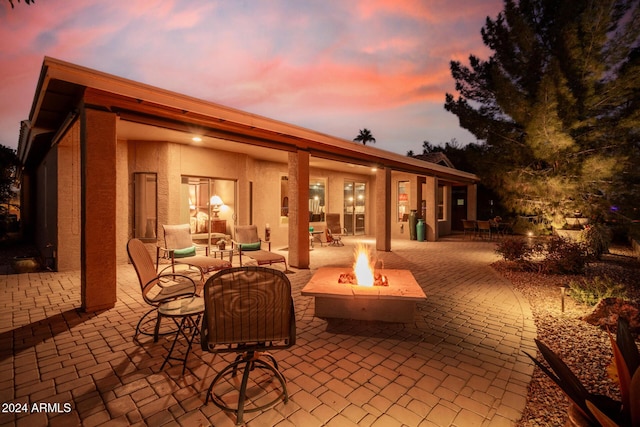 patio terrace at dusk with a fire pit