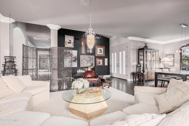 living room with hardwood / wood-style flooring and ornamental molding