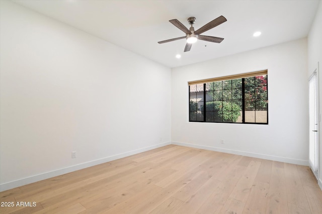 empty room featuring light hardwood / wood-style flooring and ceiling fan