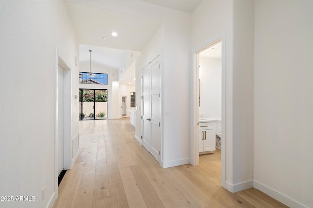 hall with light hardwood / wood-style floors