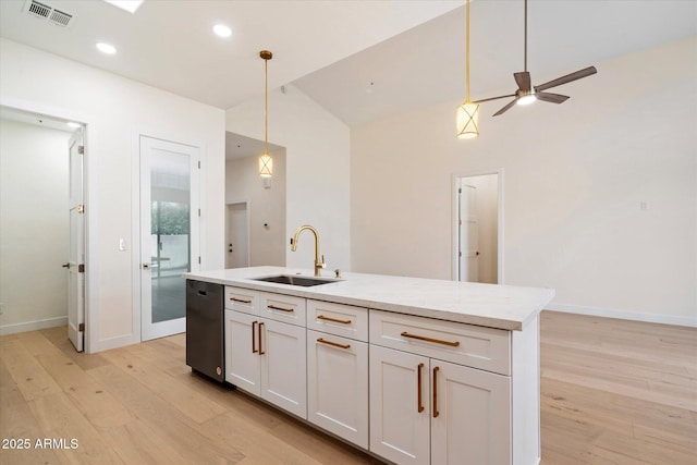 kitchen featuring pendant lighting, dishwasher, white cabinetry, sink, and an island with sink