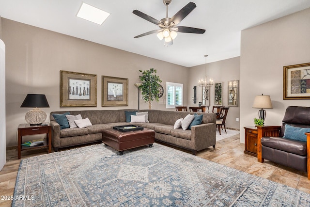 living room featuring ceiling fan with notable chandelier